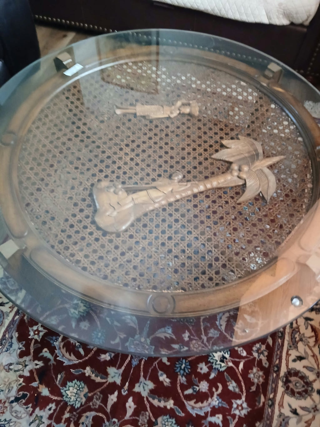 Round Glass-Top Cane Table with Carved Palm Tree Scene