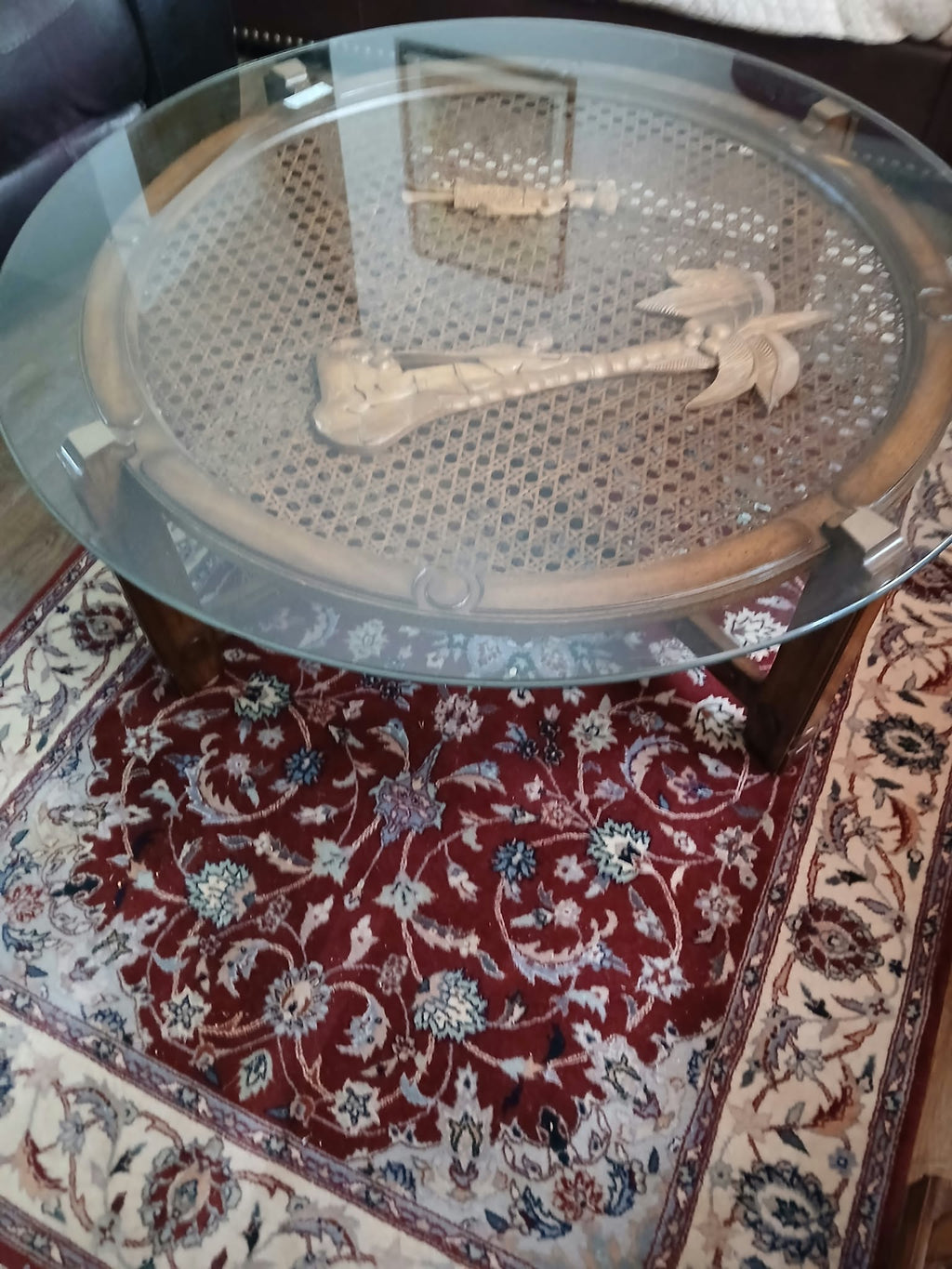 Round Glass-Top Cane Table with Carved Palm Tree Scene