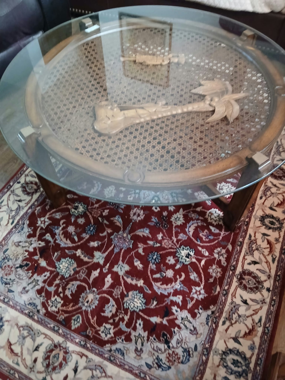 Round Glass-Top Cane Table with Carved Palm Tree Scene